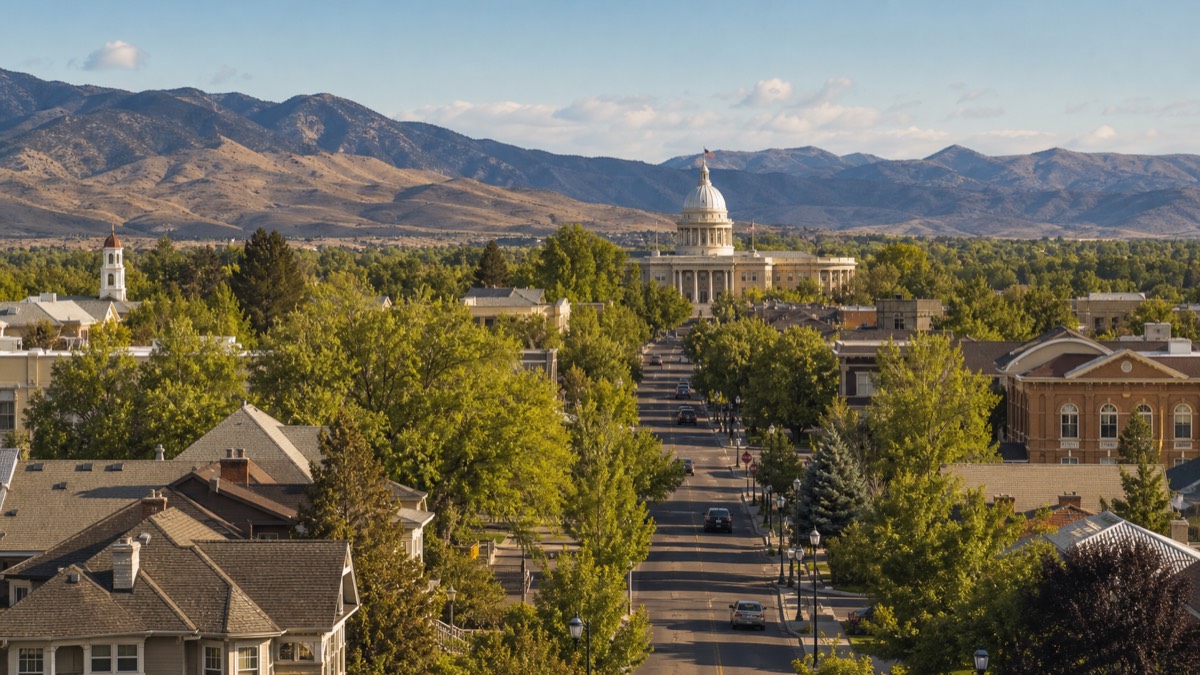 View down a tree-lined street in Carson City toward the Nevada State Capitol dome