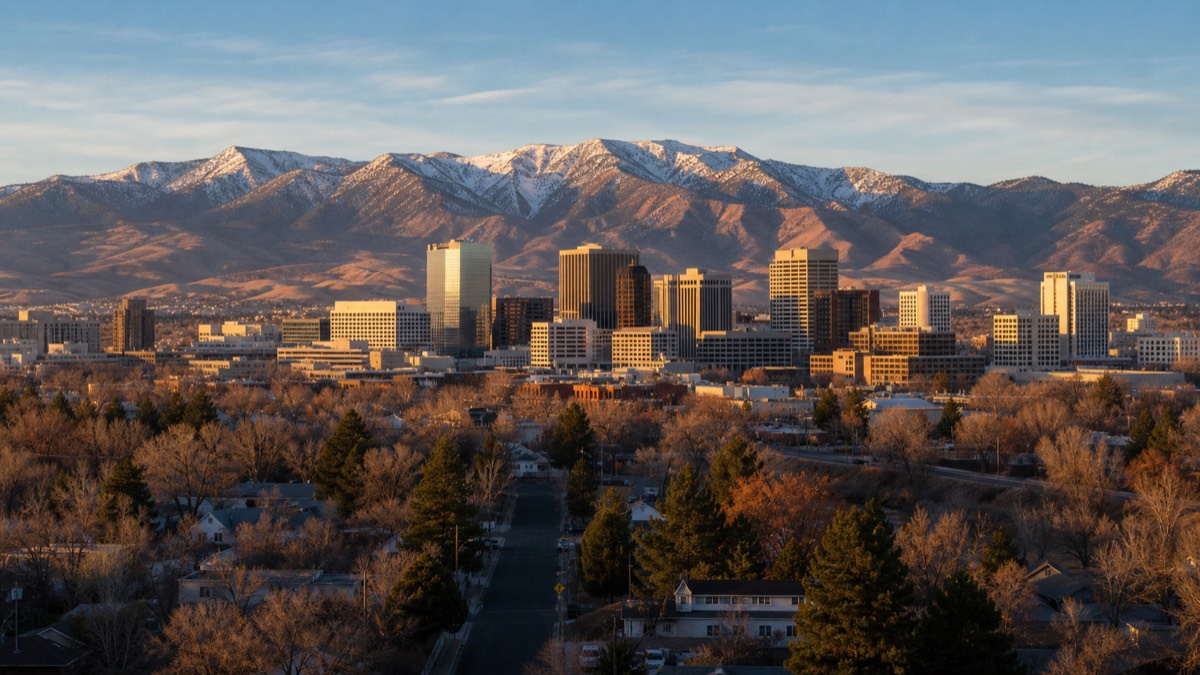 Downtown Reno skyline at golden hour with the Sierra Nevada in the background